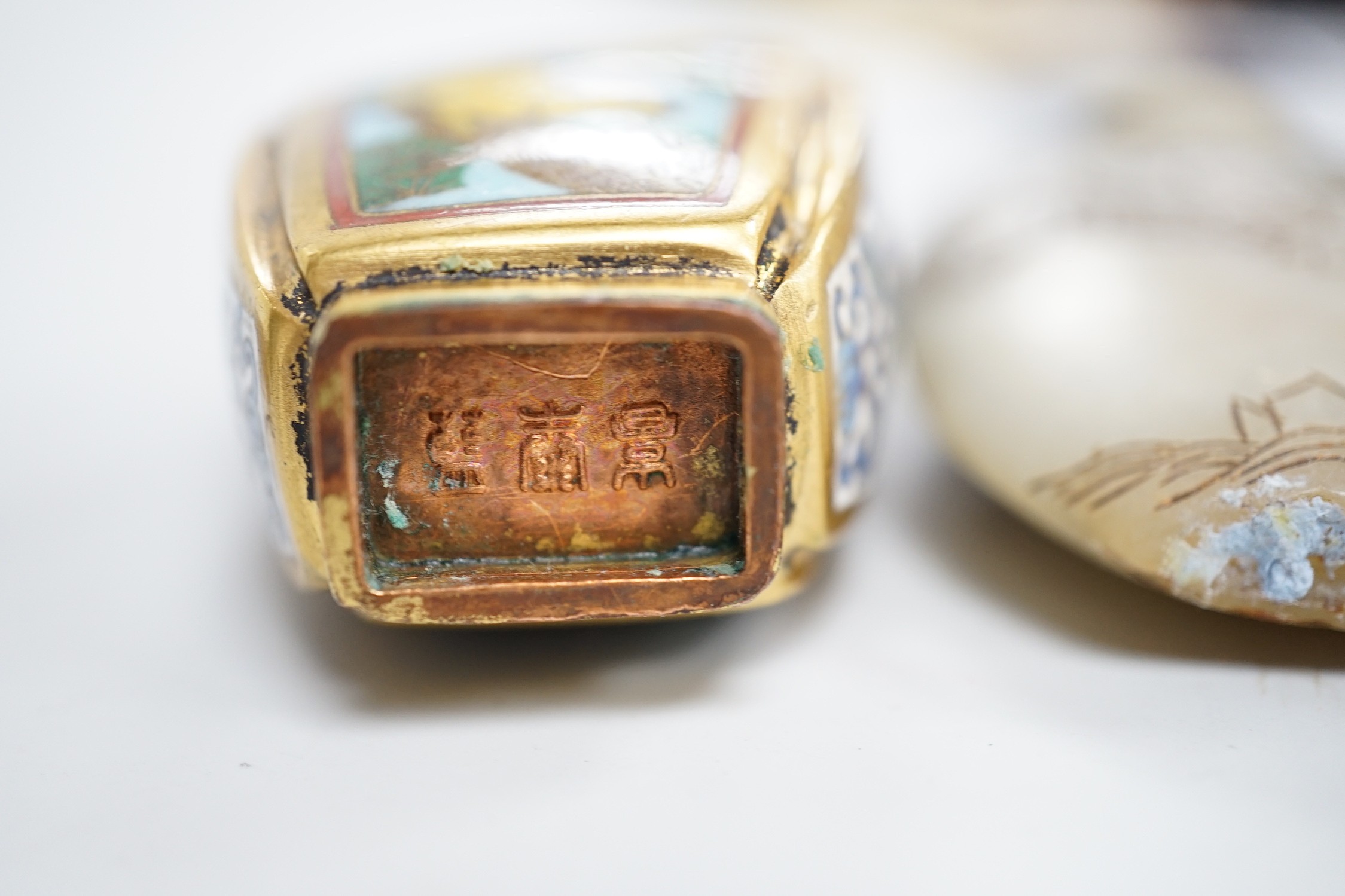 A Chinese cloisonné enamel snuff bottle, enamelled glass and stone snuff bottles. Tallest 8cm (3)
